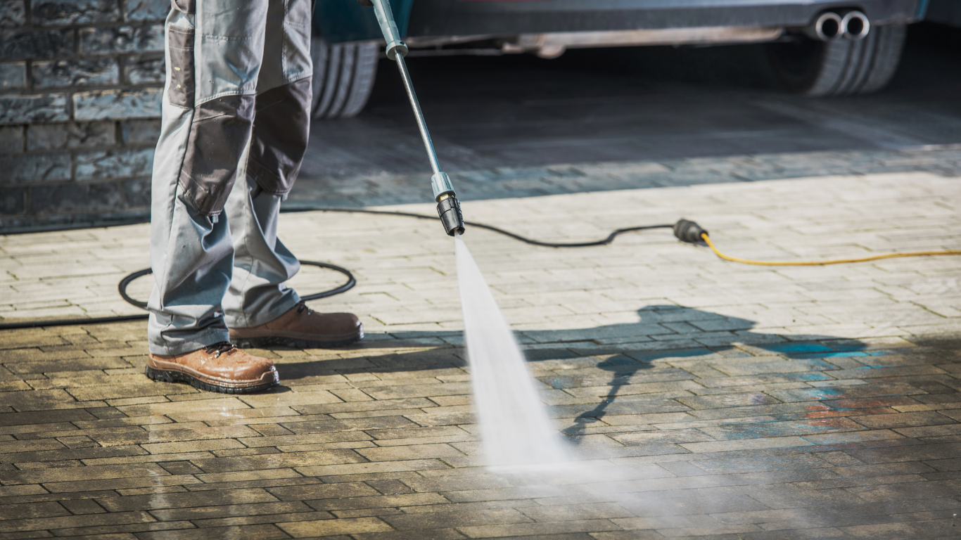Pressure washing a driveway